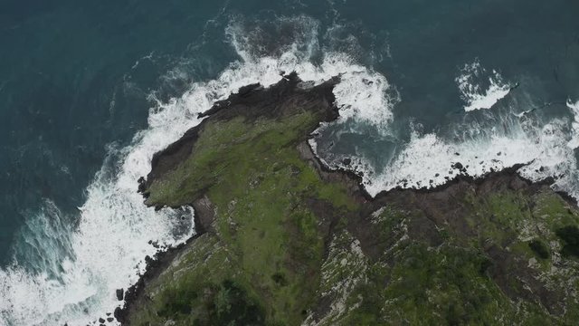 Flying above the coastline and ocean. 