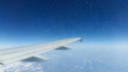 Frozen window of a plane flying over the earth