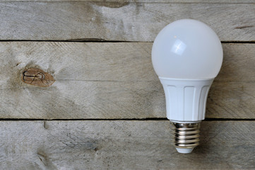 LED lamp on a wooden background. copy space