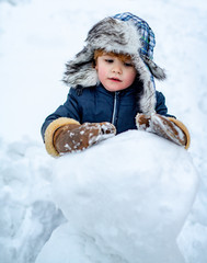 Excited kid winter portrait. Kids emotion. Winter clothes for kids. Joyful kid Having Fun with...