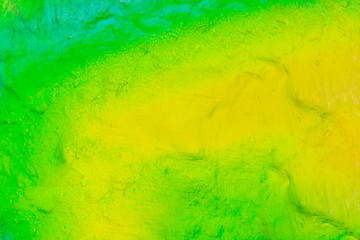 Beautiful bright colorful street art graffiti background. Abstract geometric spray drawing fashion colors on the walls of the city. Urban Culture detailed close up texture green, yellow ,blue picture