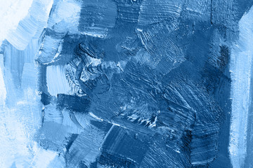 Brushstroke with oil paints in blue color on canvas. Copy space. The concept of a creative atmosphere, artistic events, education, etc.