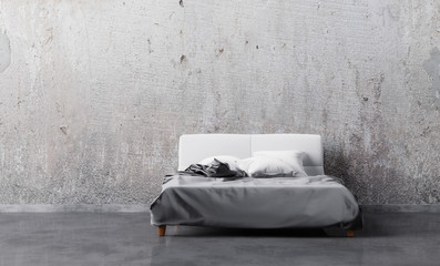 Bed with satin linen and pillows in empty room with grunge wall