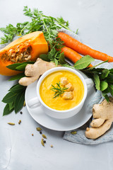 Seasonal spicy fall autumn creamy pumpkin and carrot soup