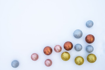 Multi-colored Christmas toys in the snow
