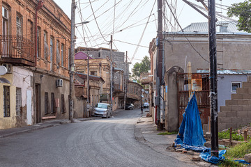 Street with old houses with rickety balconies