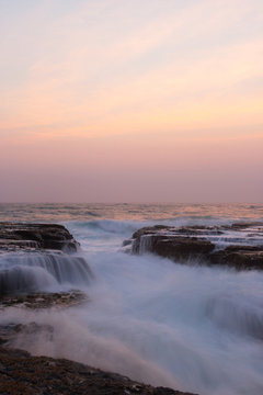 Wave water flowing between rock cracks in the morning. © AlexandraDaryl