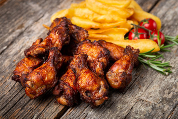 Roasted Chicken with French Fries on the wooden table
