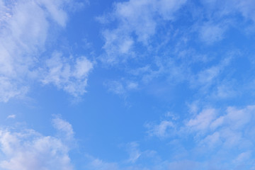 abstract background of fluffy white clouds on a bright blue sky