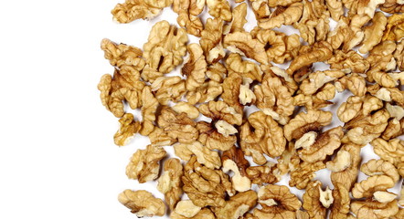 Walnut kernels, pile isolated on white background, top view