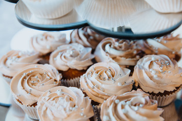 Cupcakes or muffins with cream.