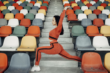 Portrait of One Sports Fitness Girl Dressed Fashion Sportswear Outfit Doing Exercise and Training at the City Stadium, Healthy Lifestyle Concept