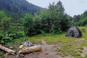 Summer camping on the lake in the woods. Tourism.