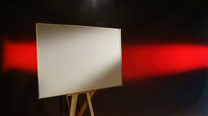 White taskboard on abstract black and red background