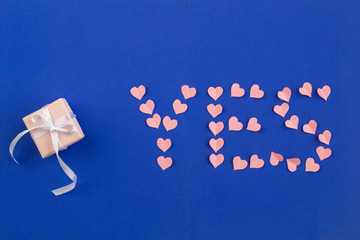 Engagement-proposal. The Background Of Valentine's Day. Gift box bows, ribbons on dark blue background.  Trending colors.  top view, copy space