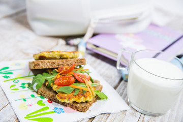 School lunch. Sandwich with vegetables and meat