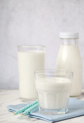 Dairy products, health concept, in glassware, on a light gray background