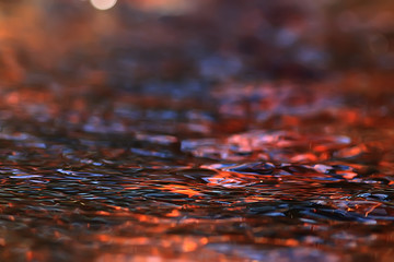 abstract background ripples on water / brown stream, water texture brown color on the swamp, peat