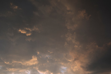 Dramatic sky with dark clouds and sunlights weather concept