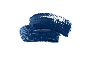 Blue stroke of the paint brush isolated on white. Classic blue color of year 2020