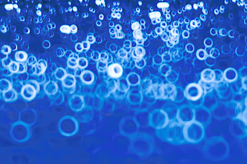 background bokeh blue rings / texture blurred background defocusing blue abstract