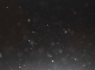 Black-White bokeh from light on a black background