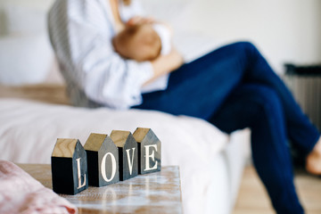 woman breast-feeding baby in a light room