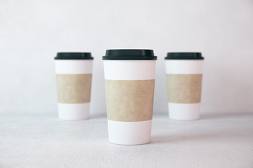 Three disposable paper cup