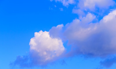 Fototapeta premium Dramatic puffy fluffy clouds isolated against blue skies