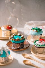 Christmas theme cupcakes in traditional red green colors and candy elements from overhead