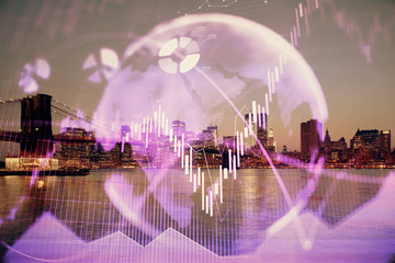 Financial graph on night city scape with tall buildings background double exposure. Analysis concept.