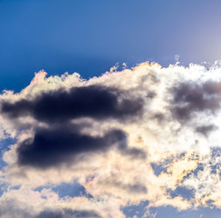 Dramatic puffy fluffy clouds isolated against blue skies