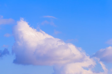 Dramatic puffy fluffy clouds isolated against blue skies