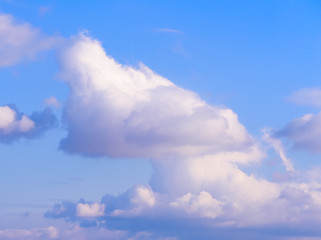 Fototapeta na wymiar Dramatic puffy fluffy clouds isolated against blue skies