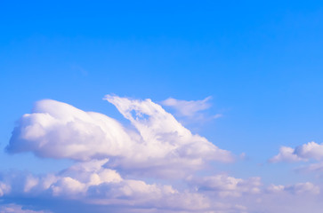 Dramatic puffy fluffy clouds isolated against blue skies