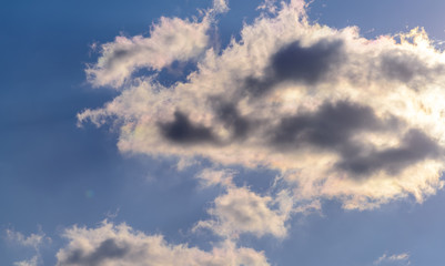Dramatic puffy fluffy clouds isolated against blue skies
