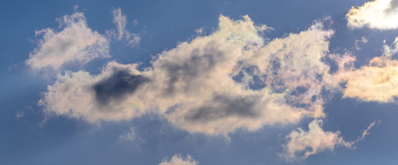 Dramatic puffy fluffy clouds isolated against blue skies