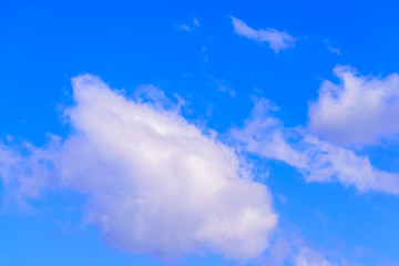 Dramatic puffy fluffy clouds isolated against blue skies