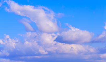 Dramatic puffy fluffy clouds isolated against blue skies