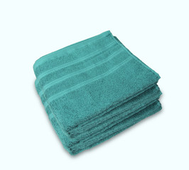 two clean terry bath green towels isolated on white background, close-up, copy space, concept of cleanliness, bath procedure, spa