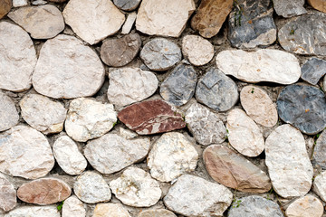 stone wall background of various elements of different shapes and cut