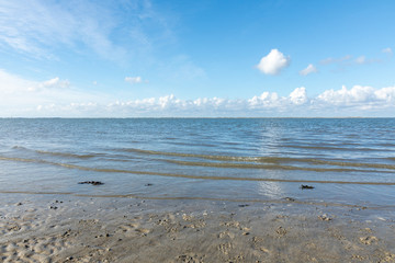 north sea in germany with water, waves and sky