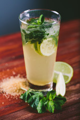 Mojito cocktail with lime and mint in glass 