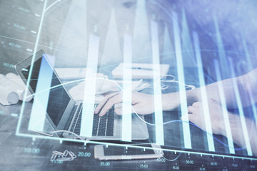 Double exposure of forex chart with man working on computer on background. Concept of market analysis.