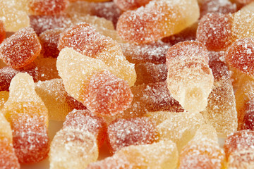 Cola with a taste of sticky jelly in the form of a bottle of Cola with sugar topping, background...