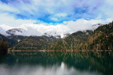 Fototapeta na wymiar landscape sky snow mountains and mountain Lake
