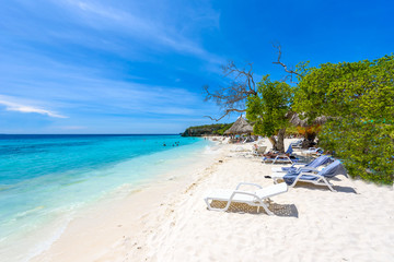 Cas Abao beach - paradise white sand Beach with blue sky and crystal clear blue water in Curacao,...