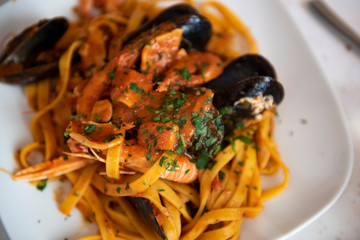 linguine with tomato sauce with scampi and mussels