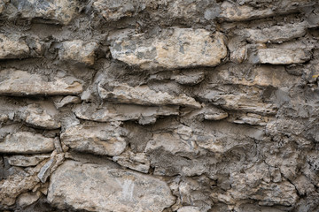 Stone wall background and ancient tuff,Italy