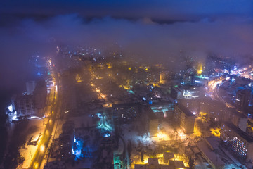The city Chisinau in winter, at night with lights. Aerial view